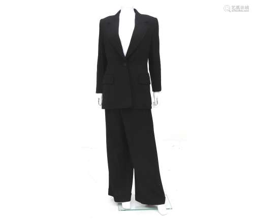A black Hermès two-piece suit with light pinstripe. Includin...