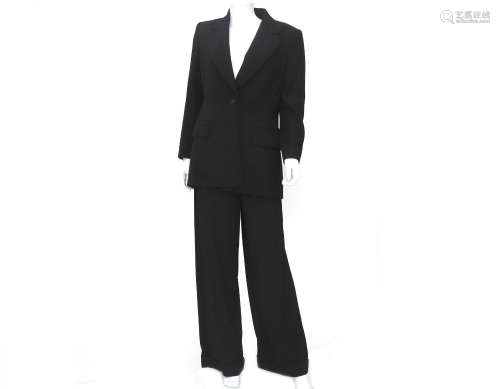 A black Hermès pinstripe suit. Composeed of a blazer and tro...