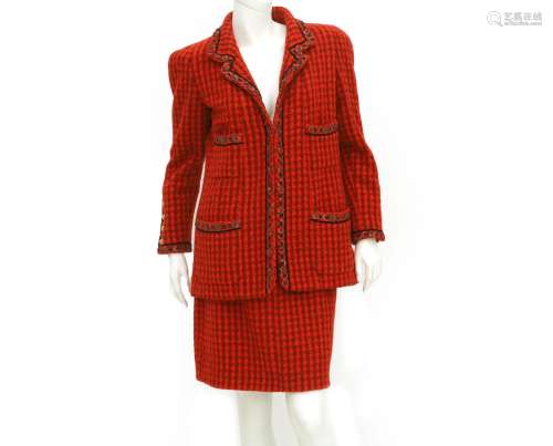 A red Chanel Boutique ensemble. Composed of a checkered red ...