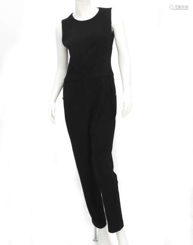 A black Chanel Boutique pantsuit. The pantsuit has two inter...