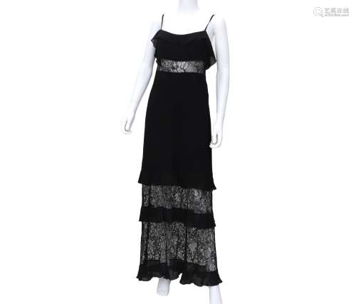 A black Chanel Boutique dress with lace. The dress has thin ...