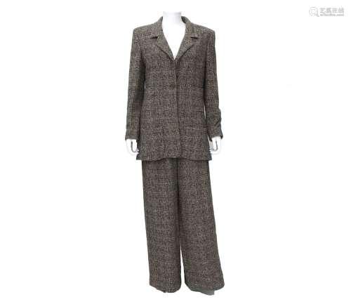 A beige Chanel Boutique suit of a blazer and trousers. Incl....
