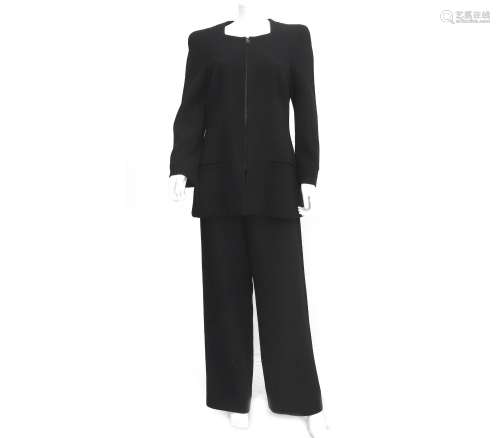 A black Chanel Boutique suit consisting of a vest and trouse...