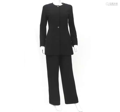 A black Chanel Boutique suit with blazer and trousers. The b...