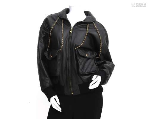 A black Chanel Boutique leather jacket. Elaborated with chai...