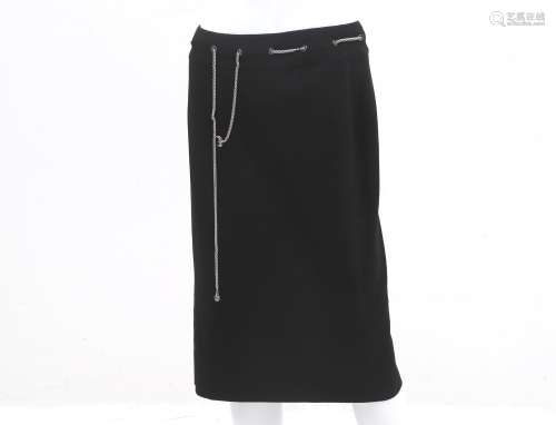 A black Chanel skirt with silver tone chain belt. The cc log...