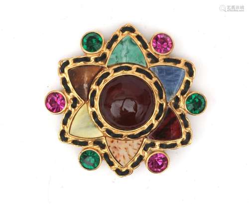 A Chanel Gripoix star brooch in Byzantine style. A gold tone...
