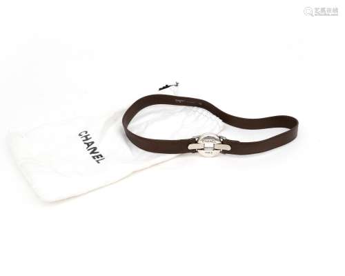 A brown leather Chanel belt with buckle. A brown lam`s leath...