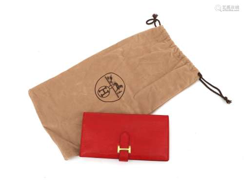 A red Hermès Bearn wallet of epson leather. A rectangular de...