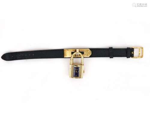 A Hermès Kelly lady`s wristwatch. A gilded case, fitting and...