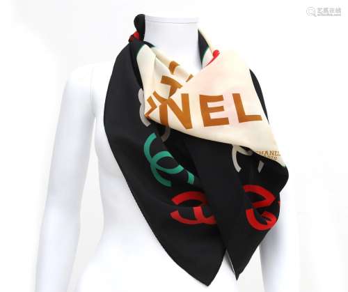 A silk Chanel scarf with CC logo print. Featuring dark blue ...