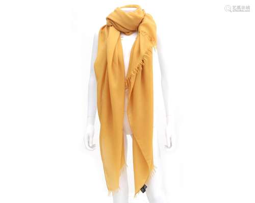 A Hermès ocher yellow foulard of woven cashmere and wool. 20...