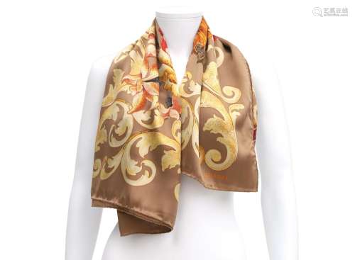 A Chanel silk scarf with flower and bird pattern. A beige gr...