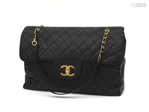 A black leather Chanel XXL travel flap bag, 1994-1996.1996. ...