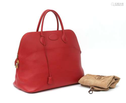 A scarlet red leather Hermès Bolide bag, 1995. A top handle ...