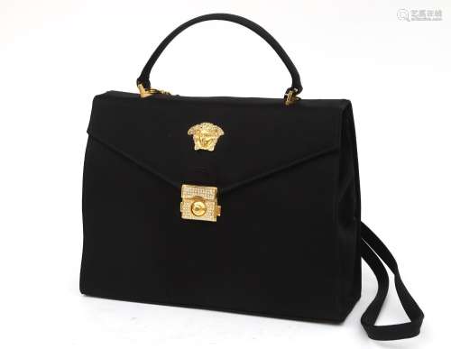 A black Versace bag, ca. 1990. A Gianni Versace couture blac...