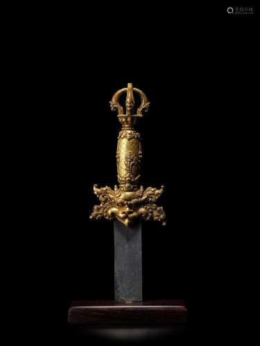 A GILT COPPER ALLOY RITUAL SWORD HANDLE TIBET, 15TH/16TH CEN...