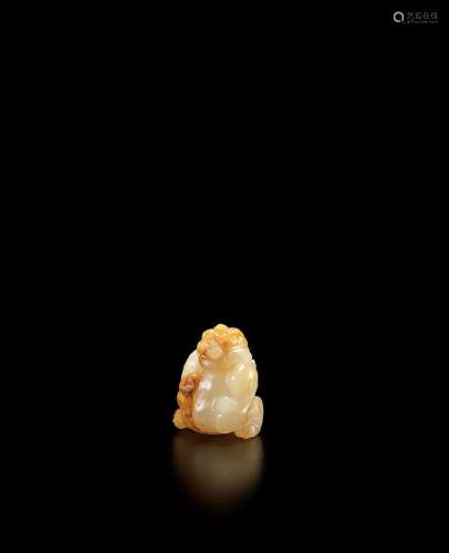 A WHITE AND RUSSET JADE CARVED MYTHICAL BEAST, BIXIE Han Dyn...