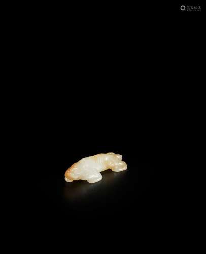 A WHITE AND RUSSET JADE CARVING OF A TIGER  Song/Ming Dynast...