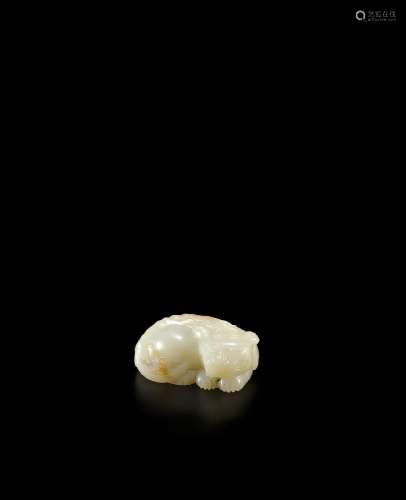 A WHITE AND RUSSET JADE CARVING OF A MYTHICAL BEAST  18th ce...