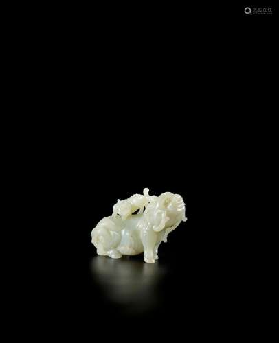 A PALE GREEN JADE CARVING OF TWO MYTHICAL BEASTS Qing Dynast...