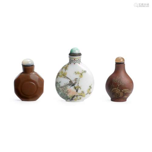 TWO OPAQUE GLASS BOTTLES AND A YIXING POTTERY BOTTLE The fir...