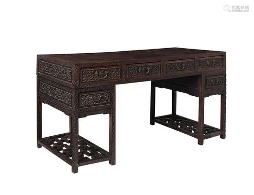 A HONGMU CARVED-FLORAL PEDESTAL DESK Late Qing dynasty, 19th...