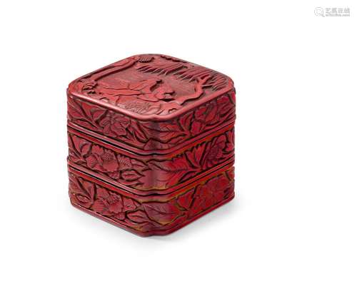 A TWO-TIERED CINNABAR LACQUER CANTED SQUARE BOX AND COVER 16...