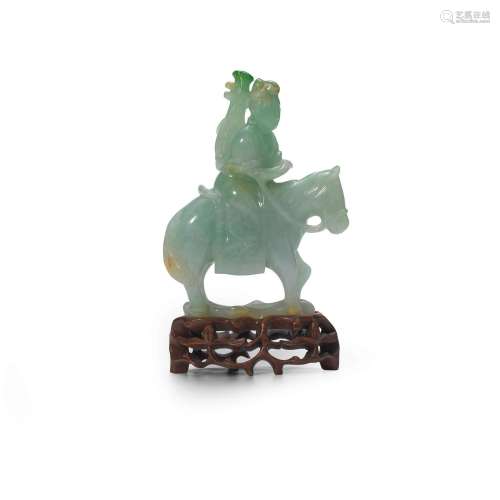 A JADEITE CARVING OF ZHAOJUN ON HORSE BACK 19th/20th century