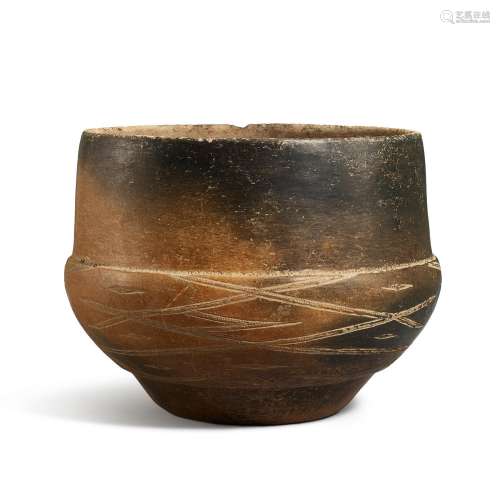 A large grey pottery bowl with engraved designs, Probably Zh...