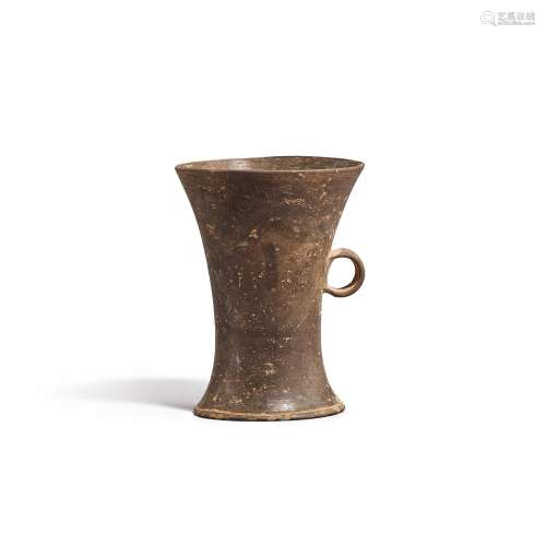 A tall grey pottery waisted cup, Dawenkou culture, 4300-2400...