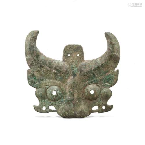 A bronze 'mythical beast' mask, Western Zhou dynasty...