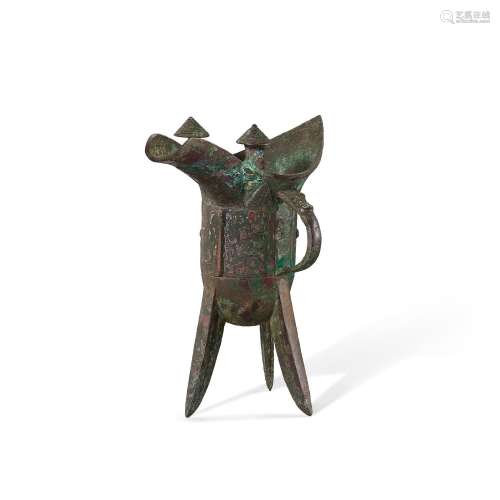A bronze 'mythical beast' tripod ritual wine vessel,...