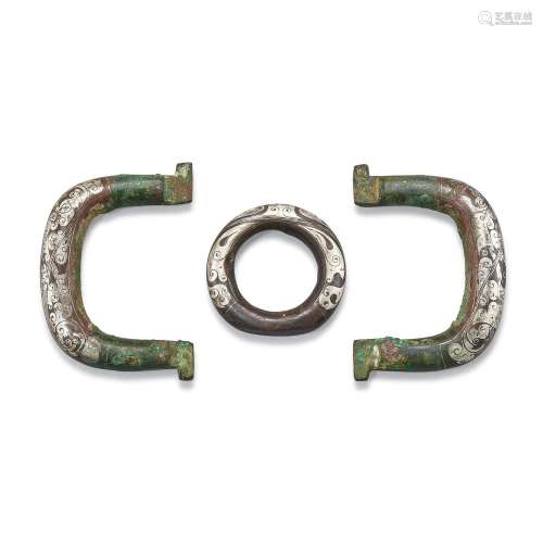 A pair of inscribed silver-inlaid chariot fittings and a sil...