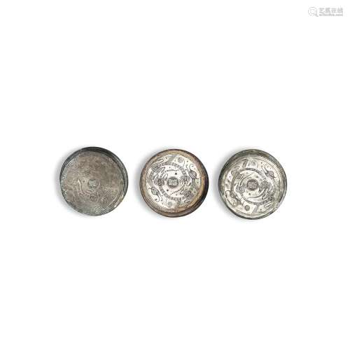 A group of three inscribed silver-inlaid bronze chariot fitt...