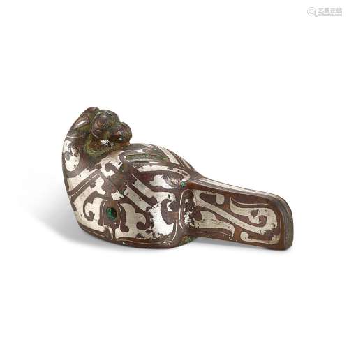 A silver-inlaid bronze 'bird' ornament, Eastern Zhou...