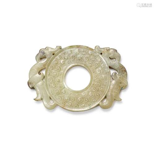 A pale celadon and grey jade disc-shaped pendant, Western Ha...