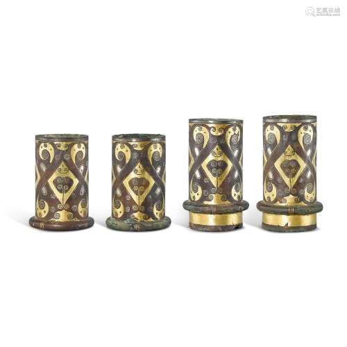 Four gold and silver-inlaid bronze chariot fittings, Eastern...