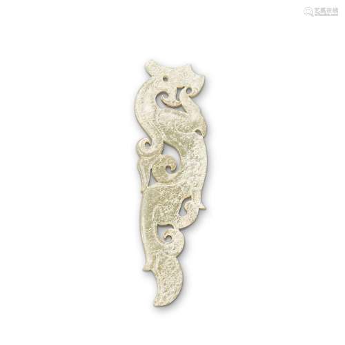 A calcified greenish-white jade 'dragon' pendant, Ha...