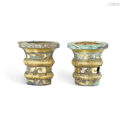 A pair of gold and silver-inlaid bronze chariot fittings, Ea...