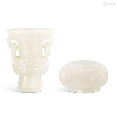 A white jade archaistic gu vase and a circular box and cover...