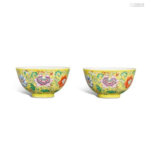 A pair of yellow-ground famille-rose 'floral' bowls,...
