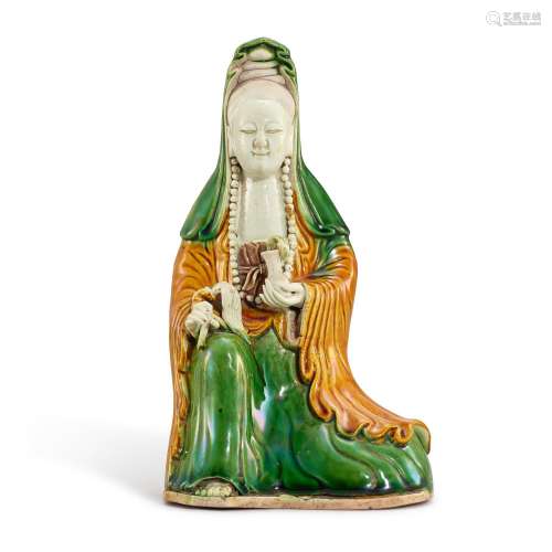 A biscuit-enamelled sancai figure of Guanyin, Qing dynasty, ...