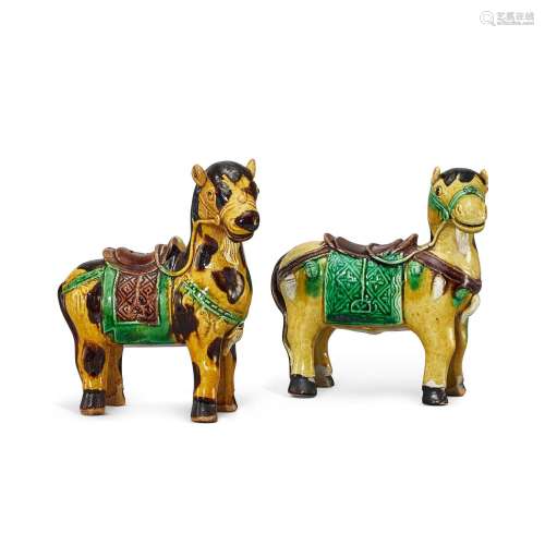A pair of biscuit-enamelled sancai horses, Qing dynasty, ear...