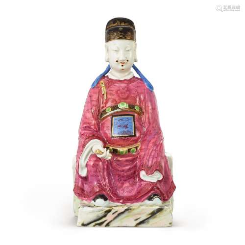 A famille-rose figure of an official, Qing dynasty, Qianlong...