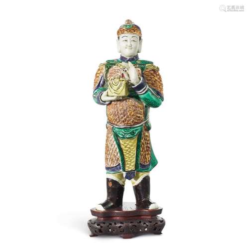 A gilt biscuit famille-verte figure of a standing warrior, Q...