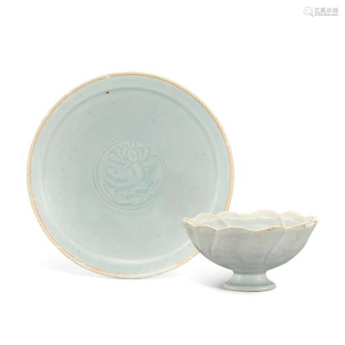A qingbai 'floral' cup and carved 'lotus' di...