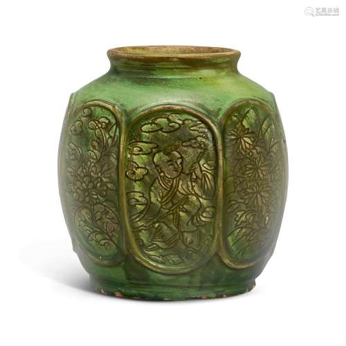 A green-glazed carved 'boys' jar, Ming dynasty 明 綠...