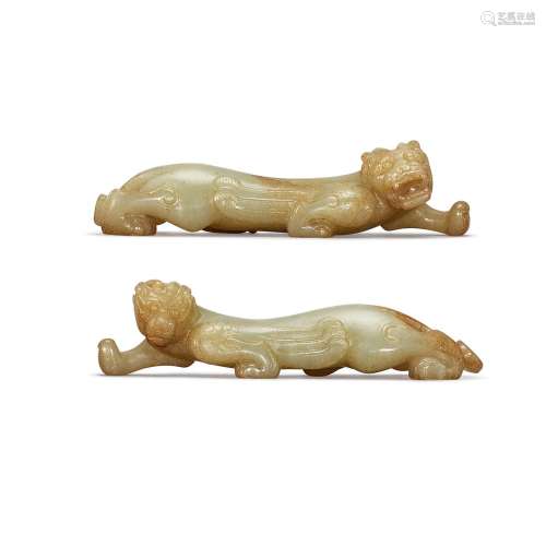 A pair of celadon jade figure of mythical beasts, Ming dynas...