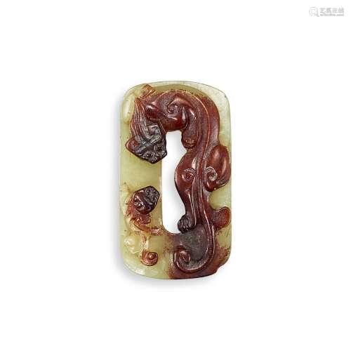 A yellow and russet jade 'chilong' pendant, Ming dyn...